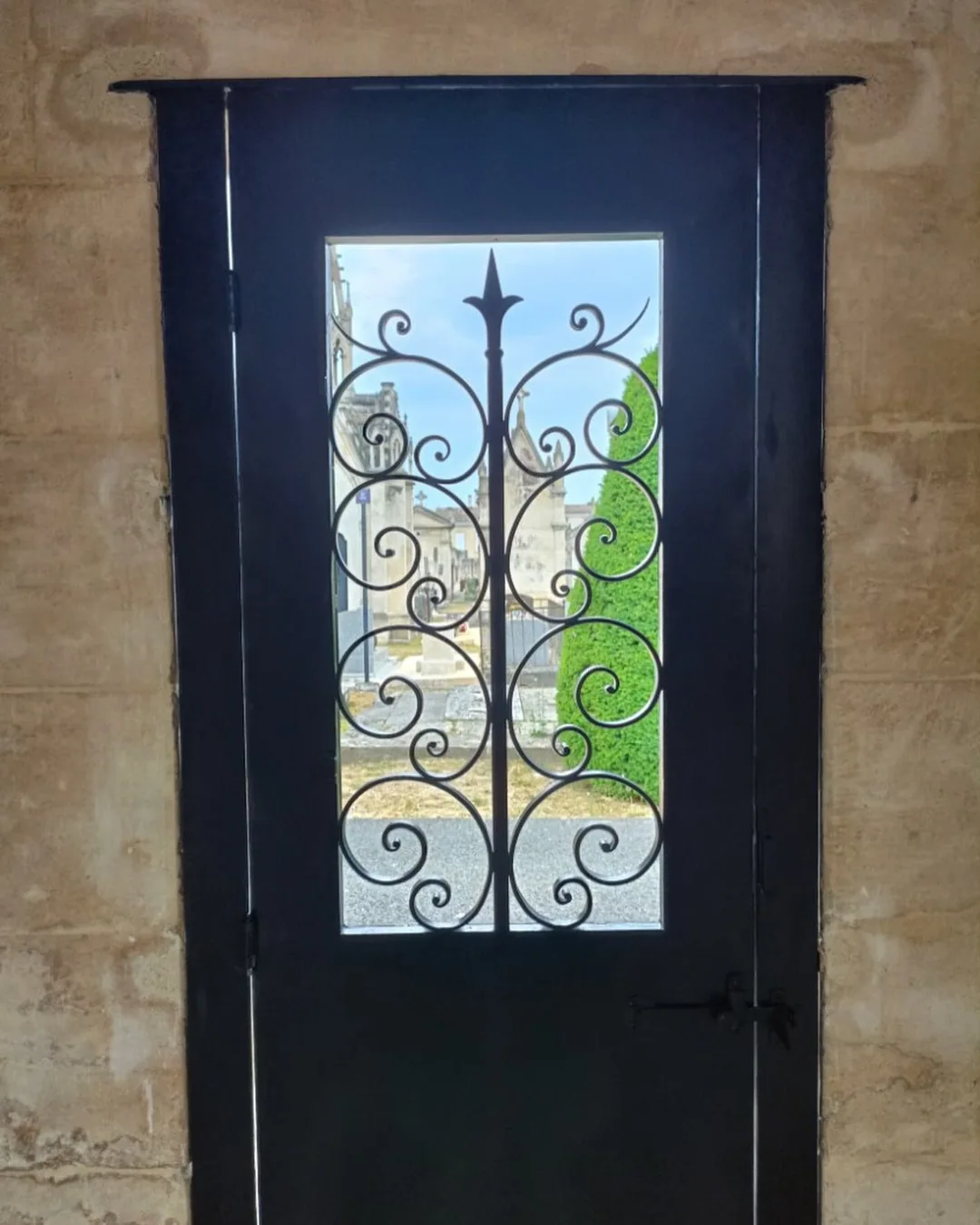 Porte vitrée en fer forgé